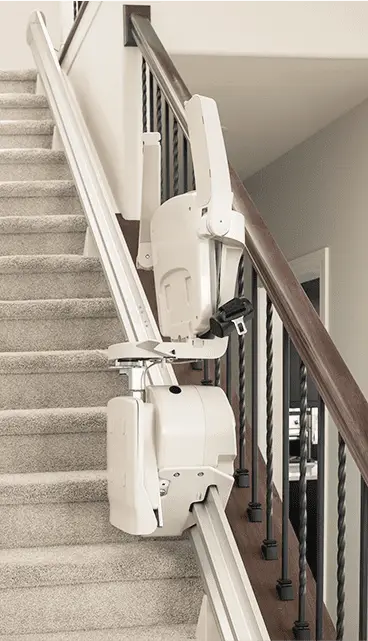 A stairlift installed in a residential home, showcasing a sleek design