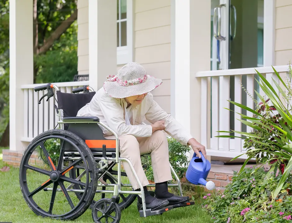 photo a an elderly woman gardening from a wheelchair